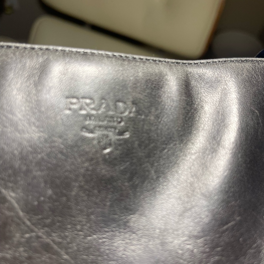 Prada women’s black leather chain bag